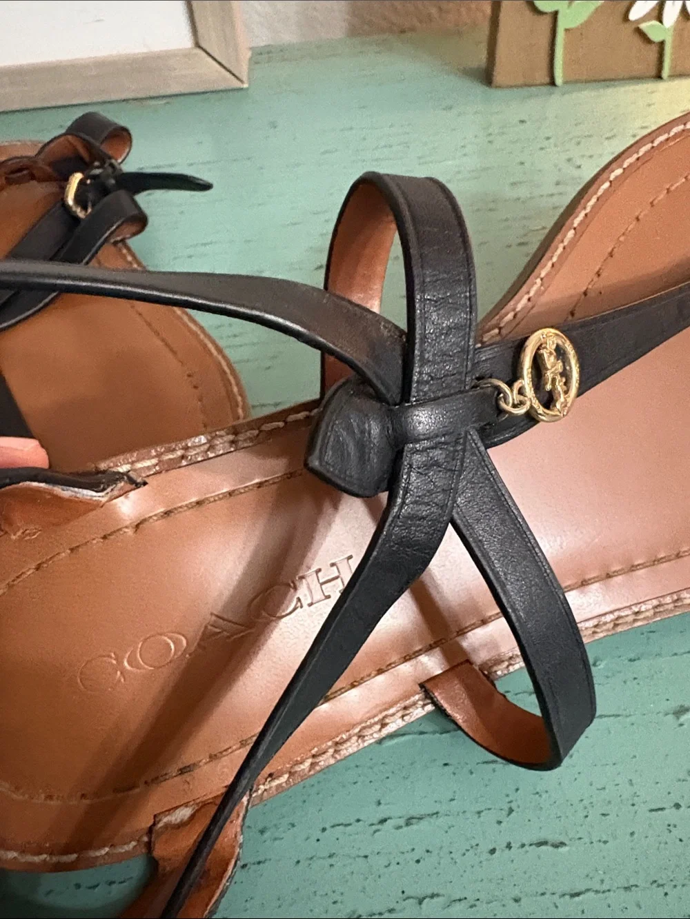 Coach Black Leather T-Strap Sandals with Gold Logo Charm